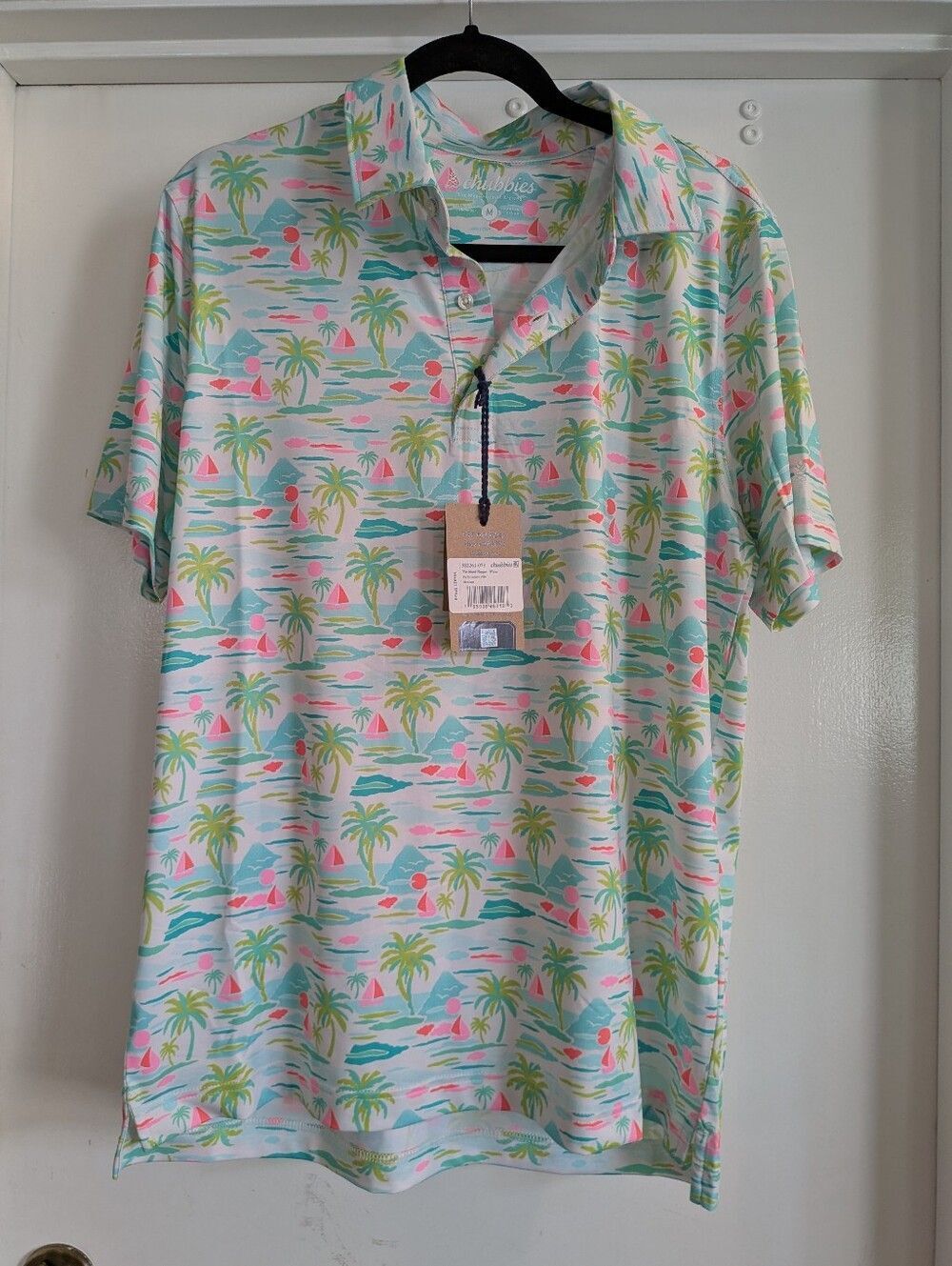 Chubbies Pastel Tropical Palm  Sailboat Polo. The Island Hopper Performance Polo
